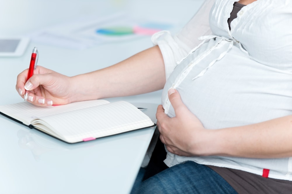 pregnant-woman-writing-creating-birth-plan | American Pregnancy Association