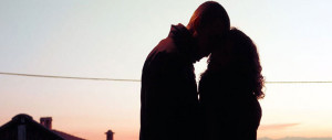 implantation-bleeding-signs-Couple-Kisses-Sunset-outside